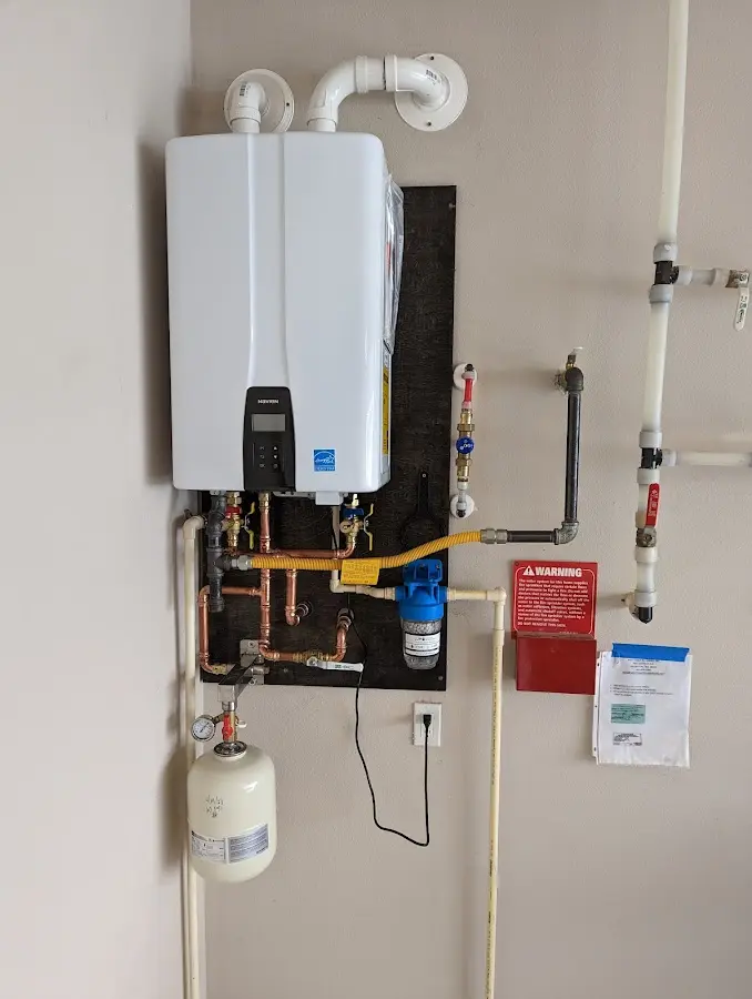 Professional plumber installing copper piping in a Mountain Park home